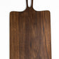 Medium size wood charcuterie board, made of a dark Walnut, with unique looped handle and exaggerated curves.
