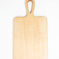Extra small wood charcuterie board, made light blonde Maple, with smooth curves and a unique teardrop handle.