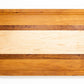 Large size wood cutting board, made of golden-brown Cherry, dark reddish-brown Sapele and light blonde Maple, with a juice groove and side handles.